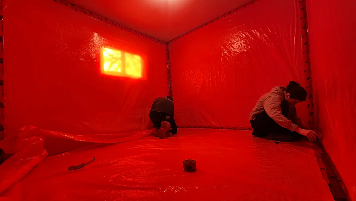 Negative-air containment established in a commercial space