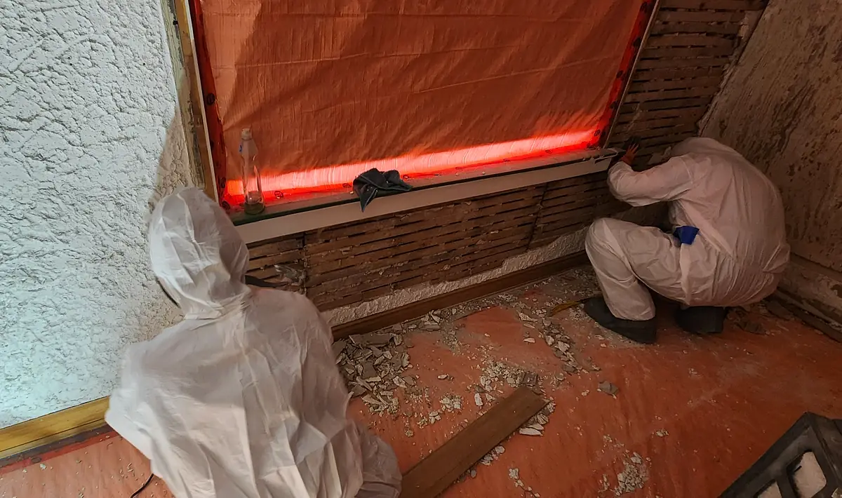 Technician working inside sealed containment